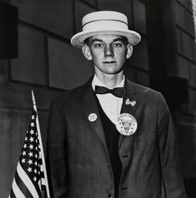 Diane Arbus, Boy with a straw hat waiting to march in a pro-war parade, N.Y.C., 1967