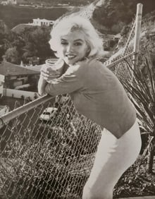 Marilyn Monroe enjoying a cocktail