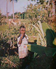 Michel Compte, Boy with homemade toy, old slave plantation, Haiti, 1997