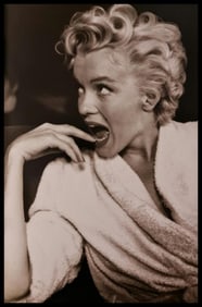 Frank Maestro, Marilyn posing for croud of photographers for premiere of East of Eden, 1955