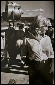 Frank Maestro, Marilyn posing for croud of photographers for premiere of East of Eden, 1955