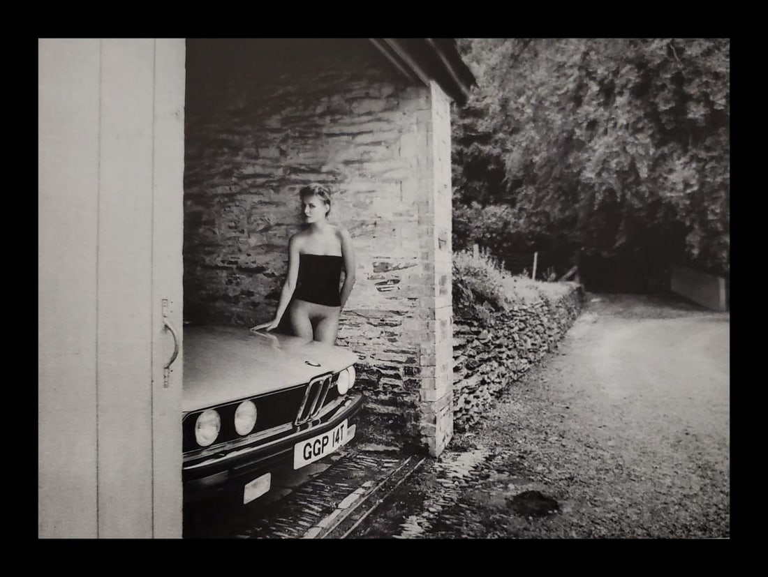 John Swannell, BMW nude, 1980's: Photographer: John Swannell was born in 1946. After leaving school at 16, he worked first as an assistant at Vogue Studios and then assisted David Bailey for four years before setting up his own studi