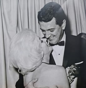 Marilyn Monroe gets a Golden Globe from Rock Hudson, 1962