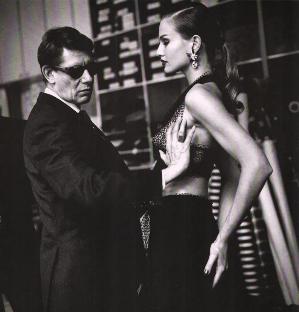 HELMUT NEWTON, Yves Saint-Laurent Creating a dress, Paris 1987: Photographer: Helmut Newton (Germany, 1920 - 2004) - best known for his erotically charged highly stylized images, Helmut Newton was one of the most influential fashion photographers of all time. Titl