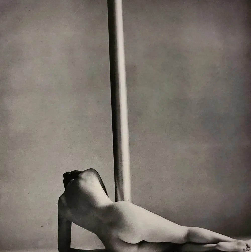 John Swannell, Woman With Pole, 1980'S: Photographer: John Swannell was born in 1946. After leaving school at 16, he worked first as an assistant at Vogue Studios and then assisted David Bailey for four years before setting up his own studi