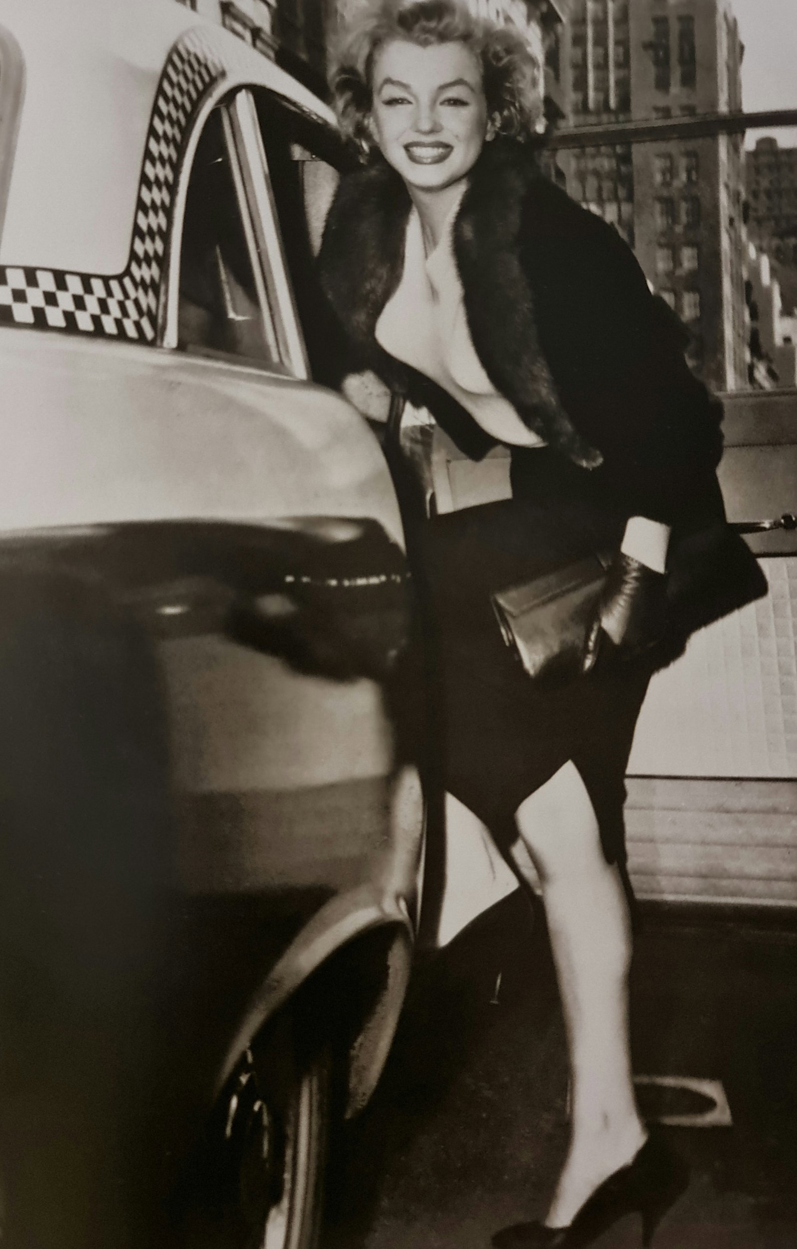 Marilyn Monroe, Getting into a NYC taxi, 1955: Photographer: Unknown Subject/Title: Getting into a NYC taxi Date Of Negative: 1939 Type Of Print: Sheet Fed Photogravure/Heliogravure Date Of Print: 2000 Publisher: teNeues Paper: Medium weight, clay