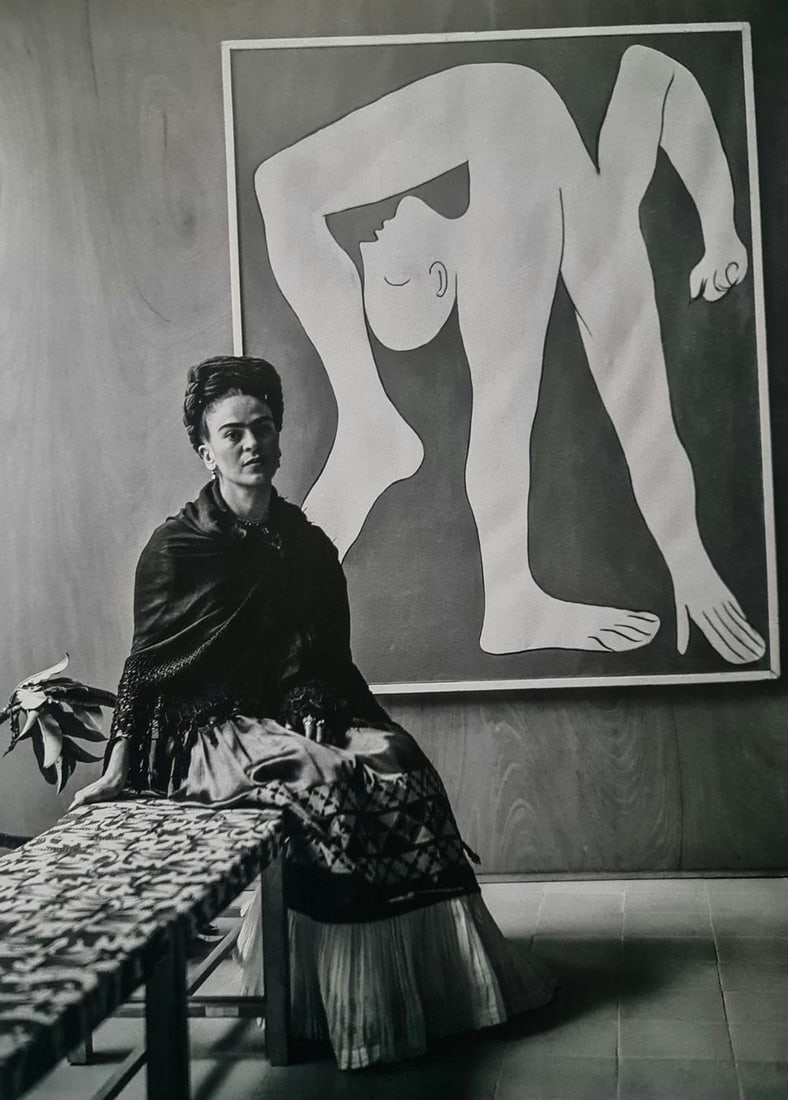 Frida Kahlo, Seated In Front Of Picasso Acrobat, 1944: Subject: Seated in front of Picasso Acrobat Subject/Title- Frida Kahlo Photos Type Of Print: Authentic Vintage Sheet Fed Photogravure/Heliogravure Date Of Print: 2021 Publisher: Taschen GmbH Paper: Me
