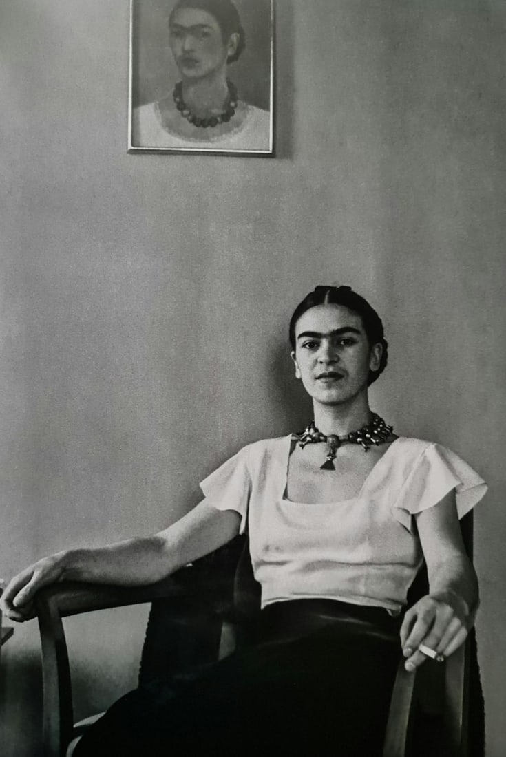 Frida Kahlo, Seated In Front Of Self Portrait, 1933: Subject: Seated in front of self portrait Subject/Title- Frida Kahlo Photos Type Of Print: Authentic Vintage Sheet Fed Photogravure/Heliogravure Date Of Print: 2021 Publisher: Taschen GmbH Paper: Medi