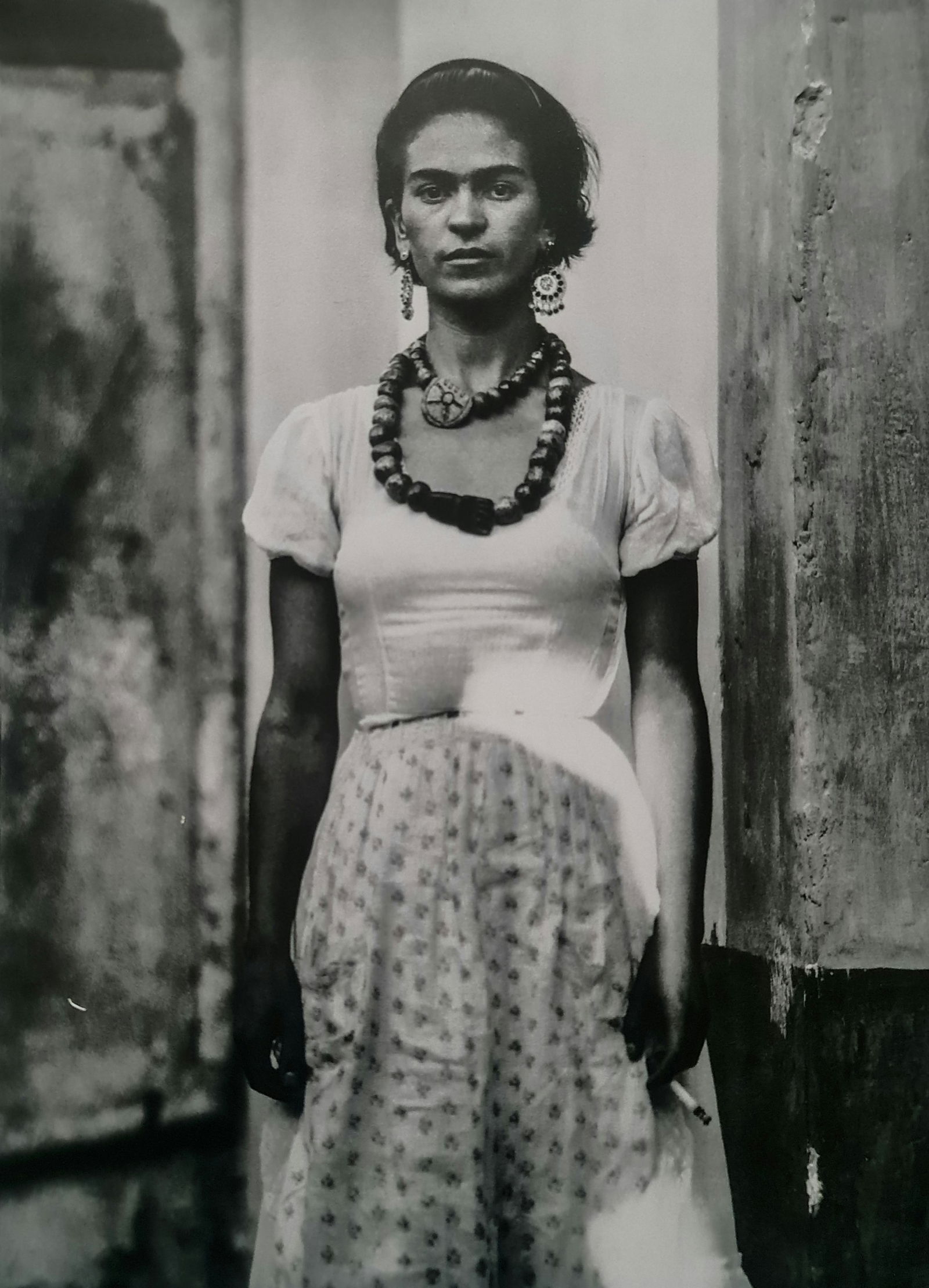 Frida Kahlo, Arms at her side: Subject: Arms at her side Subject/Title- Frida Kahlo Photos Type Of Print: Authentic Vintage Sheet Fed Photogravure/Heliogravure Date Of Print: 2021 Publisher: Taschen GmbH Paper: Medium weight, clay