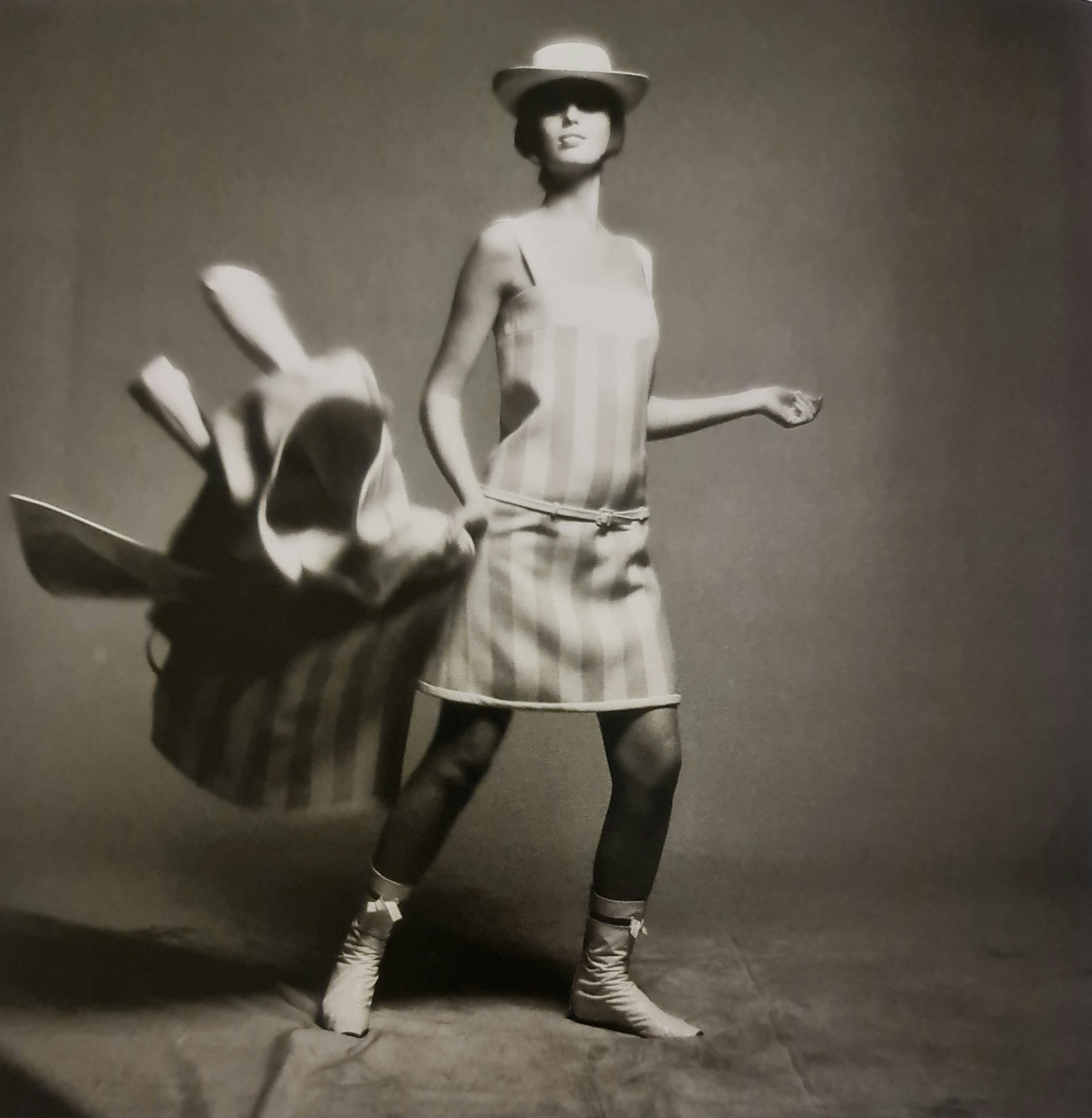Melvin Sokolski, Dot, Coat, Whip, 1965: Photographer: Melvin Sokolsky, (October 9, 1933 – August 29, 2022) was an American photographer and film director. His fantastical and occasionally surreal work brought an experimental energy to Har