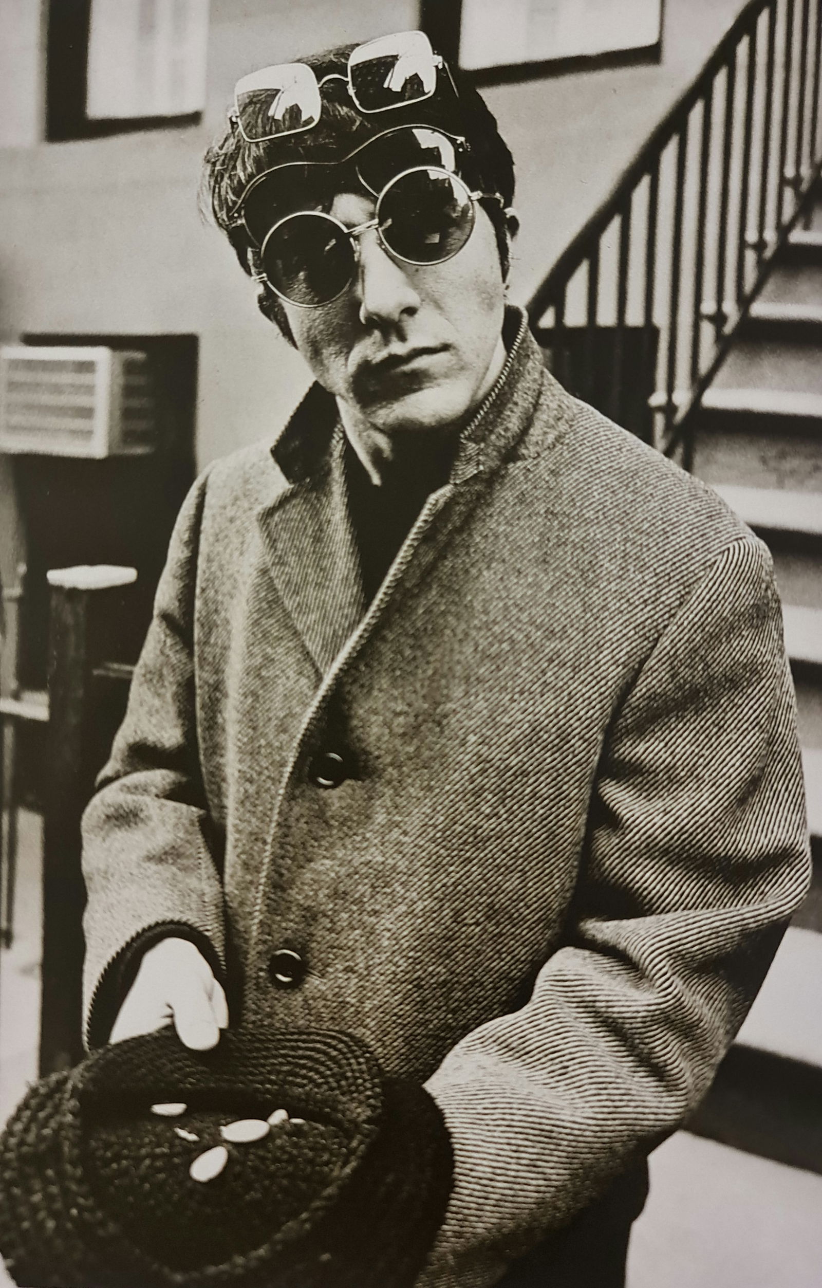 Terry O'Neill, Dustin Hoffman Improvising As A Vagrant, New York City'S East Side, 1969: Photographer: Terry ONeill was a British photographer, known for documenting the fashions, styles, and celebrities of the 1960s. Title: Dustin Hoffman improvising as a vagrant, New York City's East Si