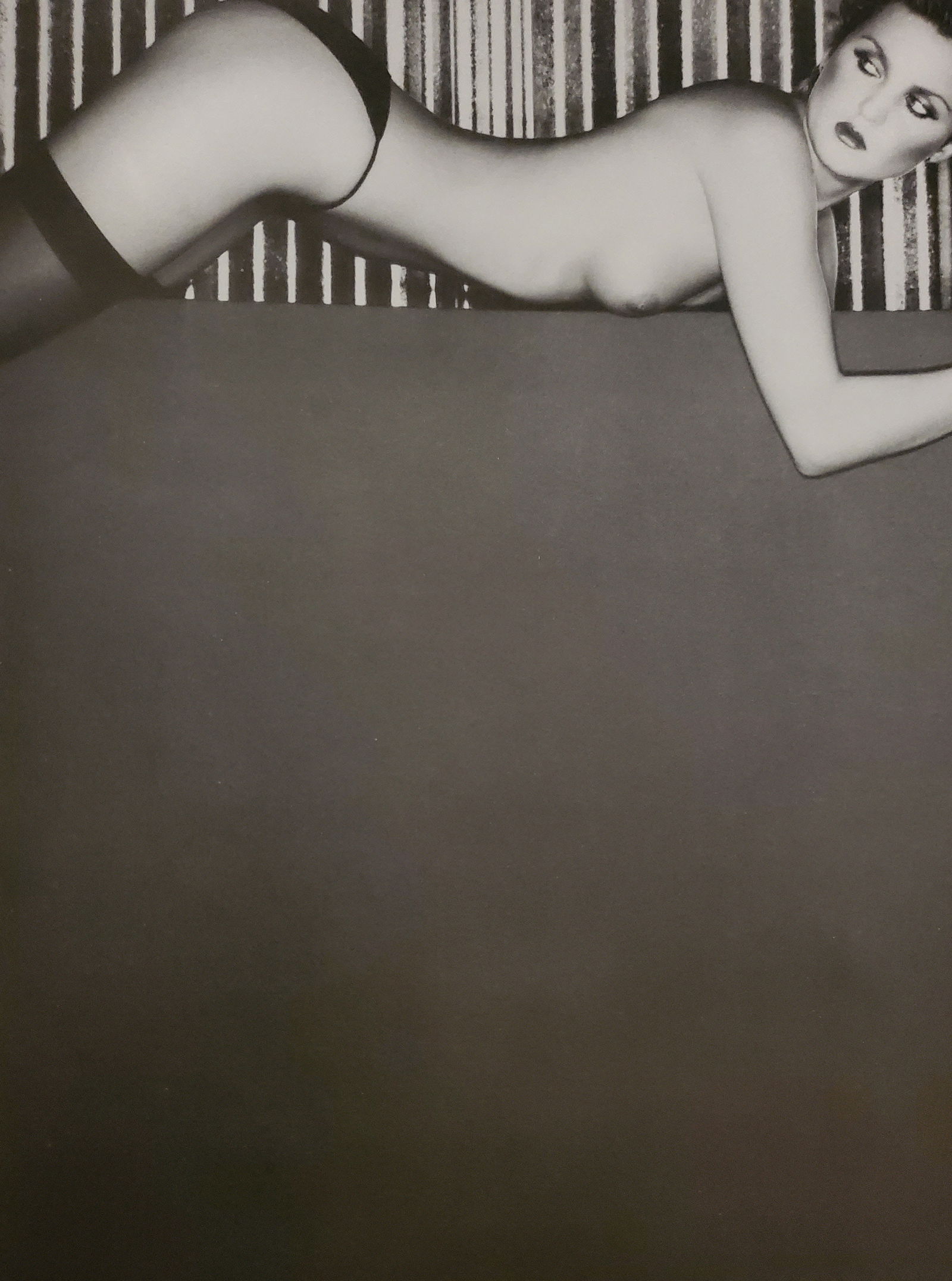 John Swannell, Lady in Repose (right), 1980's: Photographer: John Swannell was born in 1946. After leaving school at 16, he worked first as an assistant at Vogue Studios and then assisted David Bailey for four years before setting up his own studi