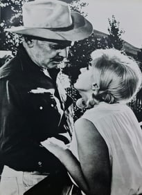 Marilyn Monroe with Clark Gable get close