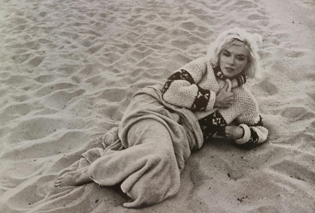 Marilyn Monroe in repose on beach: Photographer: George Barris Subject/Title: Marilyn Monroe in repose on beach Date Of Negative: Undated Type Of Print: Authentic Vintage Sheet Fed Photogravure/Heliogravure Date Of Print: 2000 Publishe