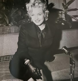 Marilyn Monroe, Beaming in black tailored suit, 1956