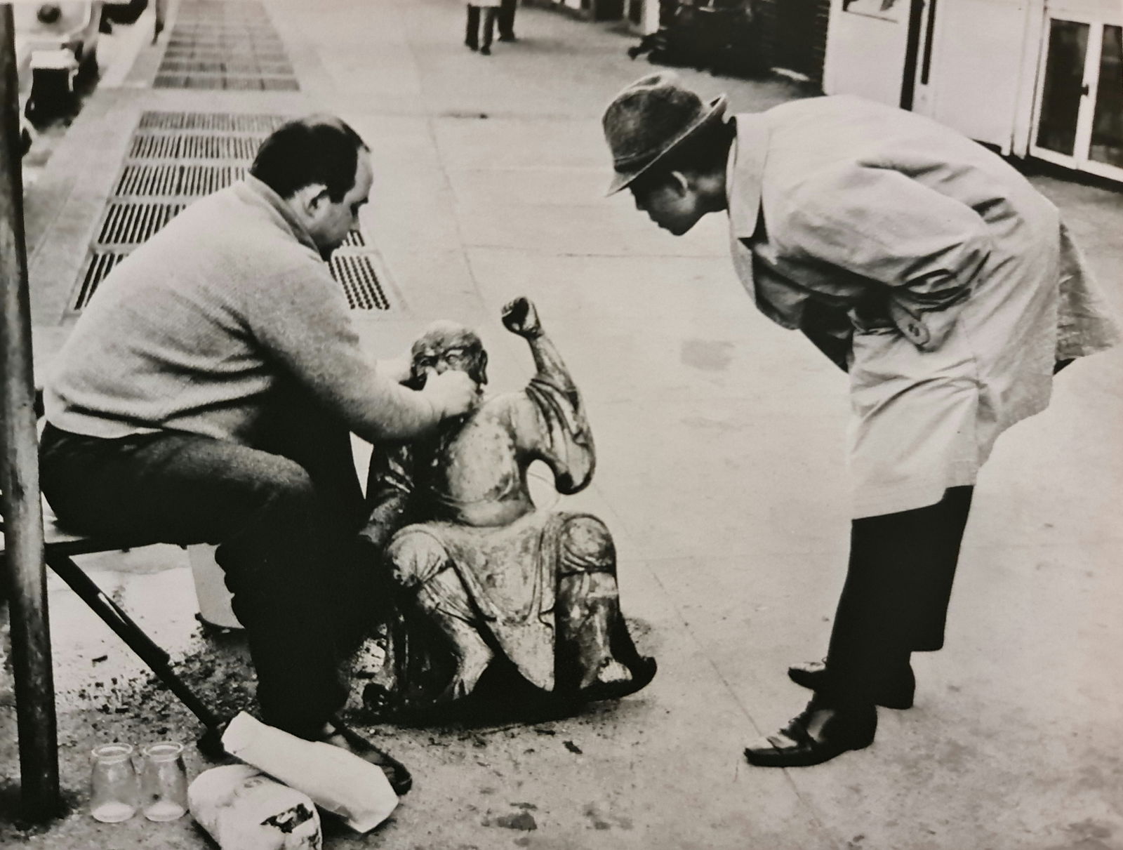 André Kertész, Cleaning up statue, 1959: Photographer: André Kertész, born Andor Kertész, was a Hungarian-born photographer known for his groundbreaking contributions to photographic composition and the photo essay. Subject: Cleaning up s