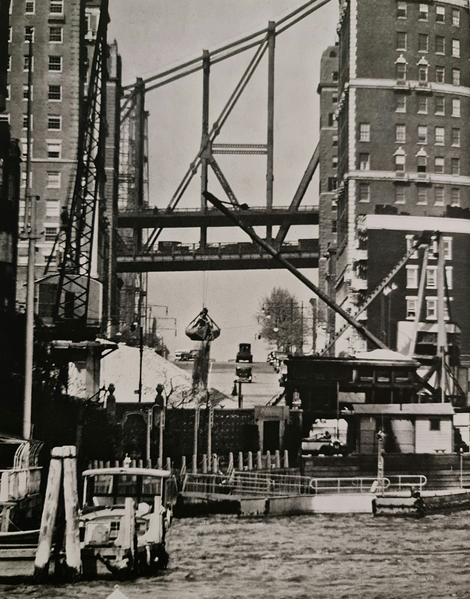 André Kertész, Construction on the water, New York, 1937: Photographer: André Kertész, born Andor Kertész, was a Hungarian-born photographer known for his groundbreaking contributions to photographic composition and the photo essay. Subject: Construction