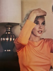 Marilyn Monroe checking vanity mirror