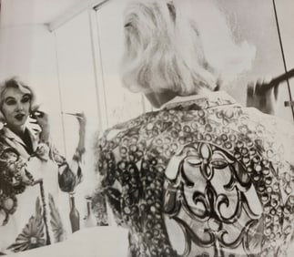 Marilyn Monroe doing her hair