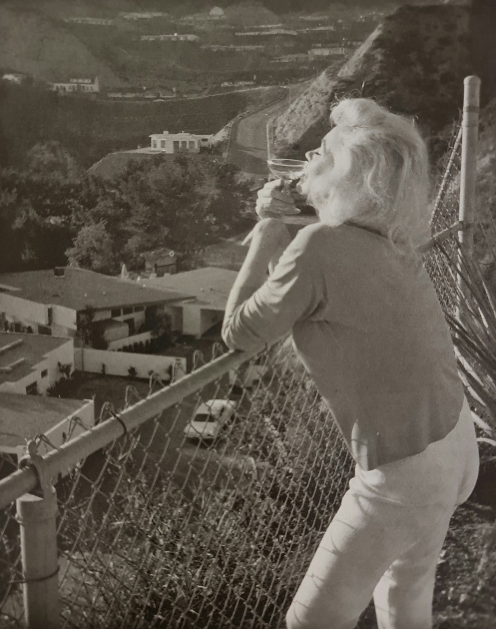 Marilyn Monroe enjoying a cocktail: Photographer: George Barris Subject/Title: Marilyn Monroe enjoying a cocktail Date Of Negative: Undated Type Of Print: Authentic Vintage Sheet Fed Photogravure/Heliogravure Date Of Print: 2000 Publish