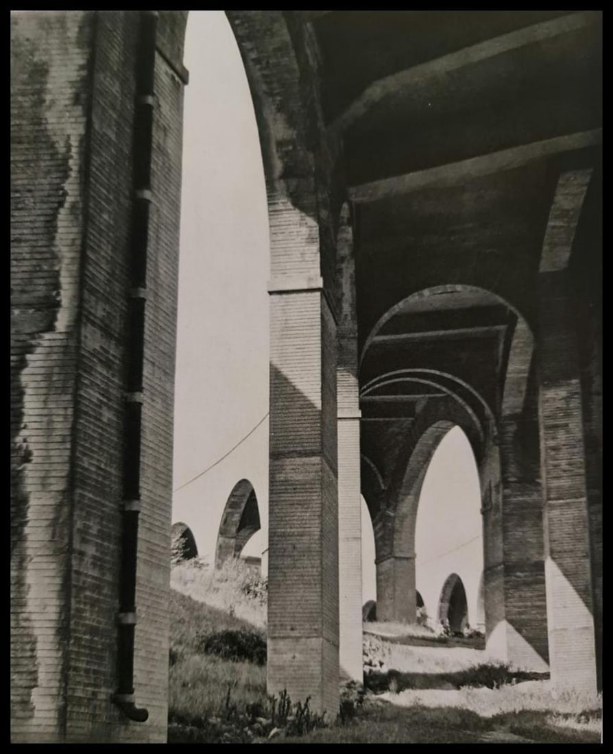 André Kertész, Bridges, New York, 1947: Photographer: André Kertész, born Andor Kertész, was a Hungarian-born photographer known for his groundbreaking contributions to photographic composition and the photo essay. Subject: Bridges, New
