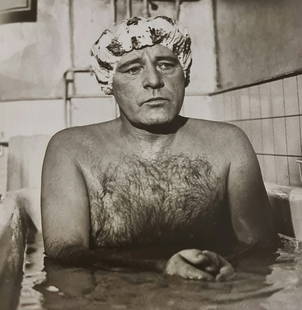 Terry O'Neill, Richard Burton Playing A Hairdresser In The Film Staircase, Paris, 1969: Photographer: Terry ONeill was a British photographer, known for documenting the fashions, styles, and celebrities of the 1960s. Title: Richard Burton playing a hairdresser in the film Staircase, Pari