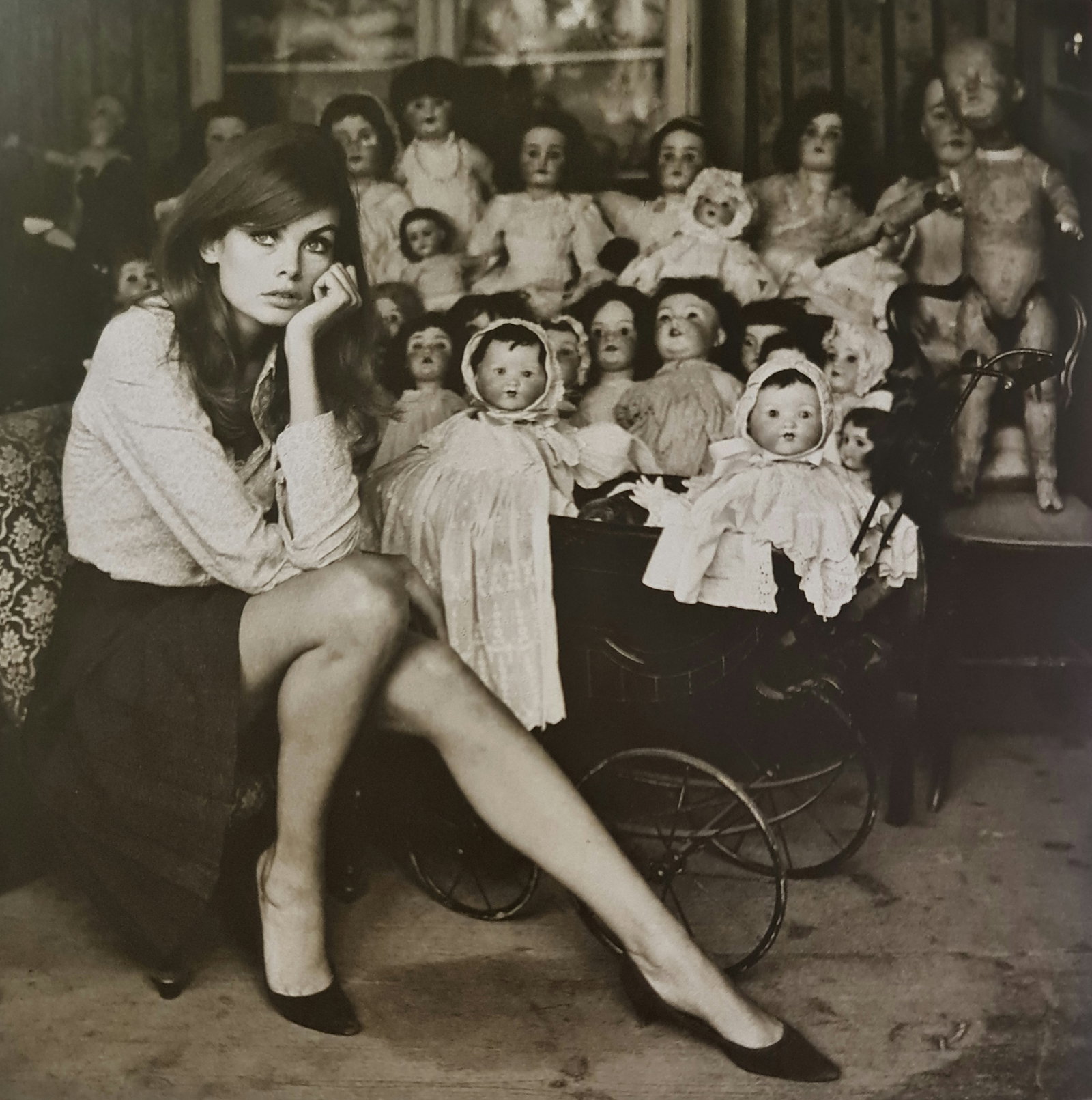 Terry O'Neill, Jean Shrimpton At A Doll'S Hospital In London, 1964: Photographer: Terry ONeill was a British photographer, known for documenting the fashions, styles, and celebrities of the 1960s. Title: Jean Shrimpton at a doll's hospital in London Date Of Negative: 