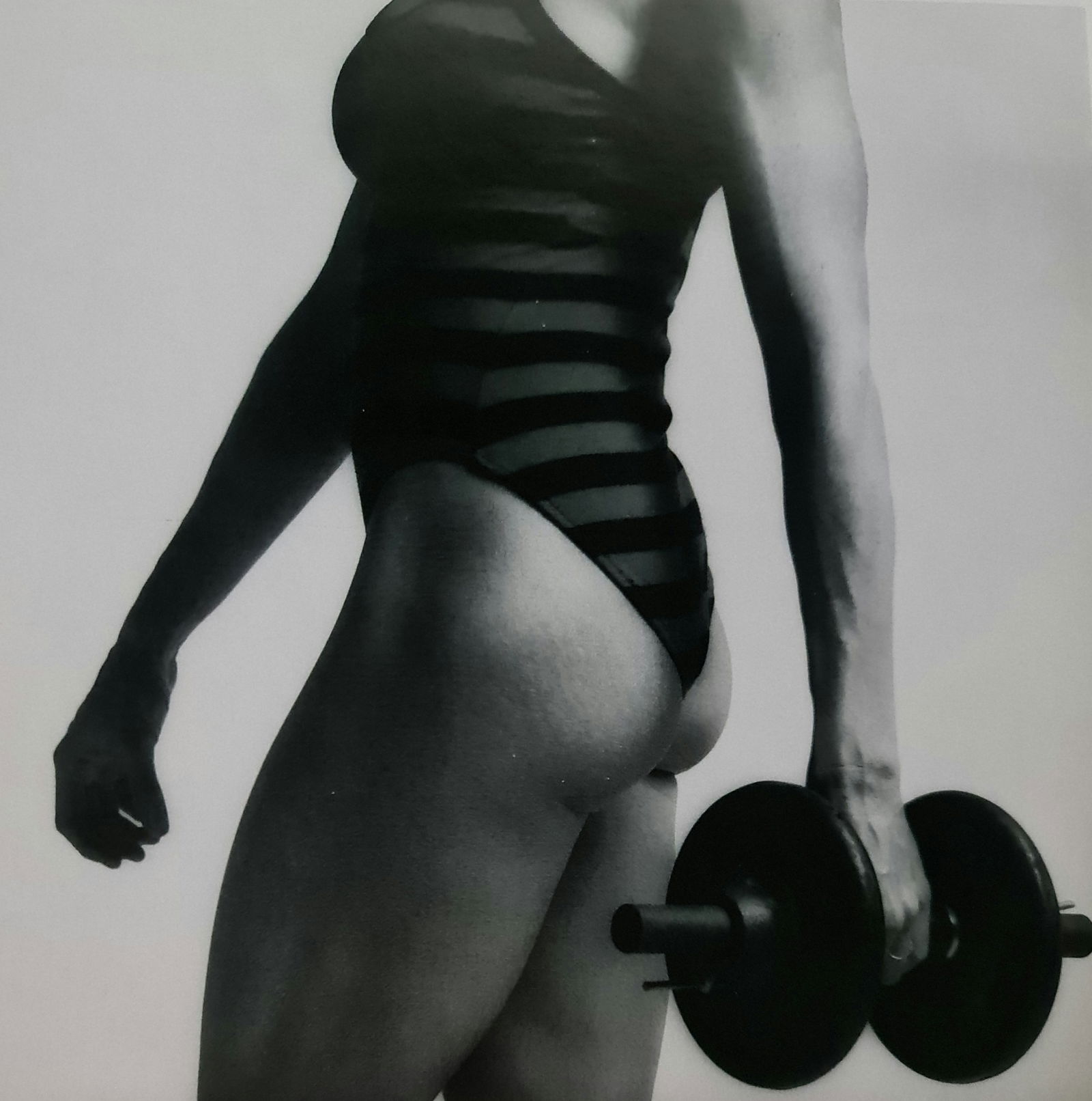 Robert Mapplethorpe, Lisa Lyon with weight: Photographer: Robert Michael Mapplethorpe (1946-1989) was an American photographer, best known for his black-and-white photographs. His work featured an array of subjects, including celebrity portrait