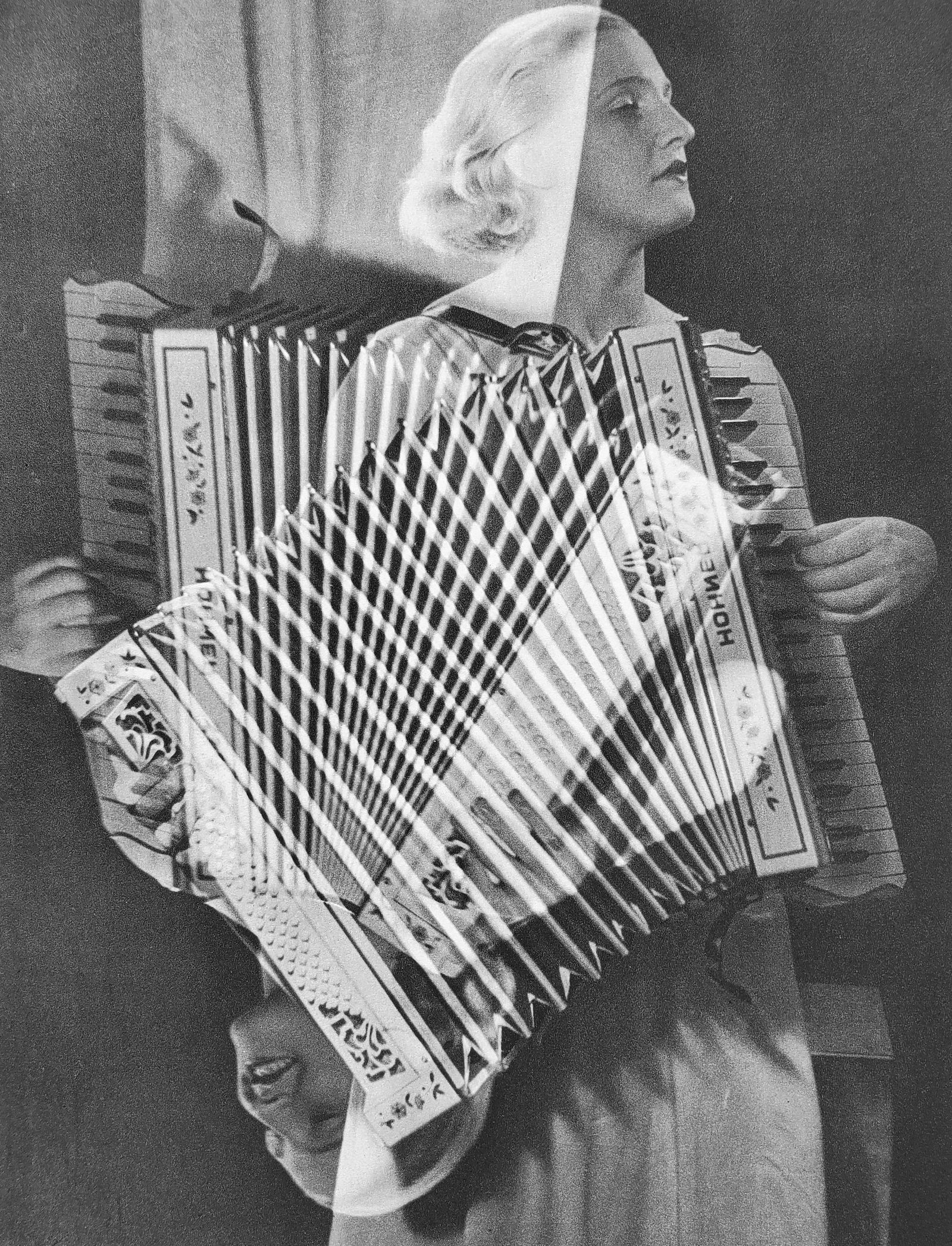 Man Ray (1890-1976), 'Refracted Visage of The Lady Accordion Player', 1934 First Edition: Photographer: Man Ray (American born, 1890 - 1976) Title: 'Refracted Visage of The Lady Accordion Player' Date Of Negative: 1930s Type Of Print: Authentic Vintage Sheet Fed Photogravure/Heliogravure.