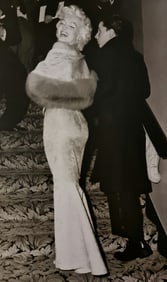 Frank Maestro, Marilyn posing for croud of photographers for premiere of East of Eden, 1955