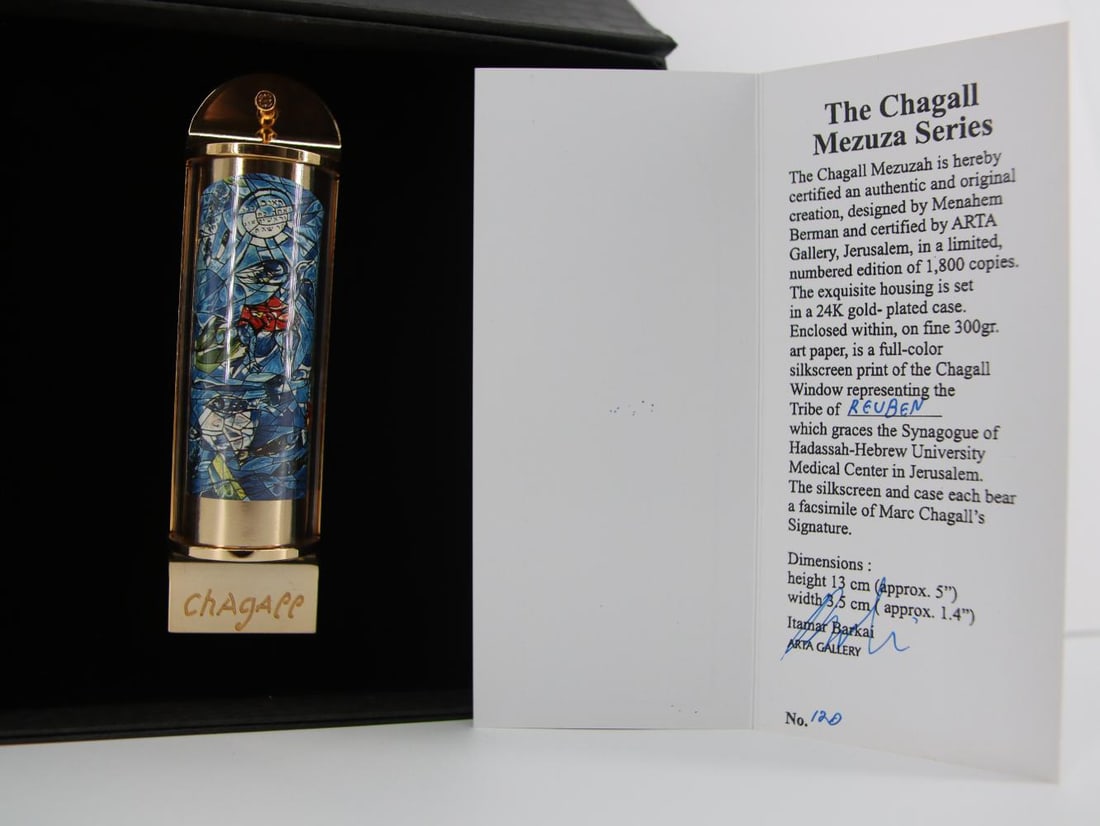 Marc Chagall, 'Reuben' Silk Screen in 24K Gold Plated Limited Edition Mezuzah: ARTIST: MARC CHAGALL TITLE: REUBEN (THE TWELVE TRIBES SERIES) MEDIUM: FULL COLOR Silk Screen IN 24K GOLD PLATED MEZUZAH SIZE: APPROX 5" X 1.5" INCHES EDITION: LIMITED EDITION SIGNED: SIGNED IN PLATE C