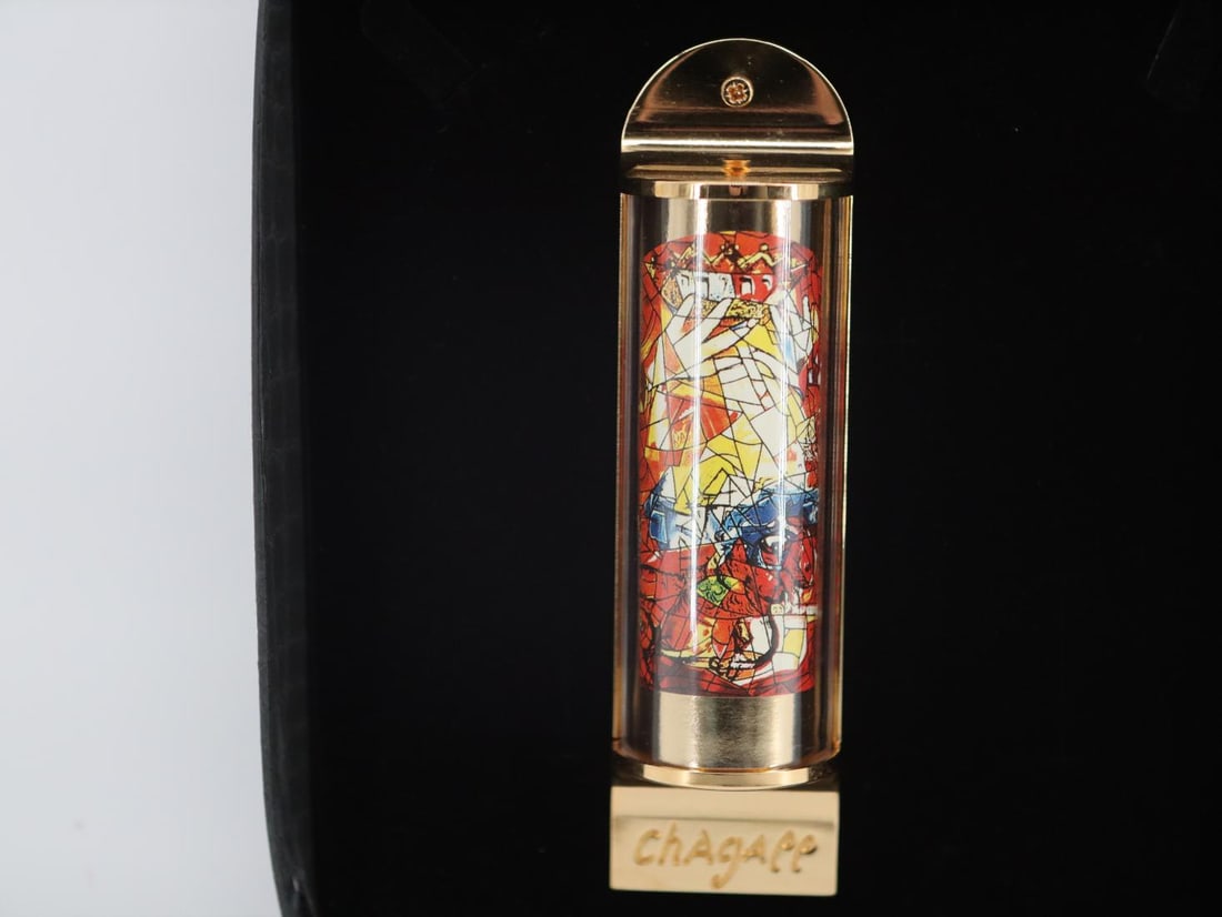 Marc Chagall, "Judah", 24K Gold Plated Limited Edition Mezuzah w/ Silkscreen: Artist: Marc Chagall Medium: Mezuzah - Exquisite glass housing is set in a 24K gold plated bronze with full color silkscreen Title: "Judah" Size: 5" x 1.5" Weight: 7 oz. Limited Edition: Edition of 30