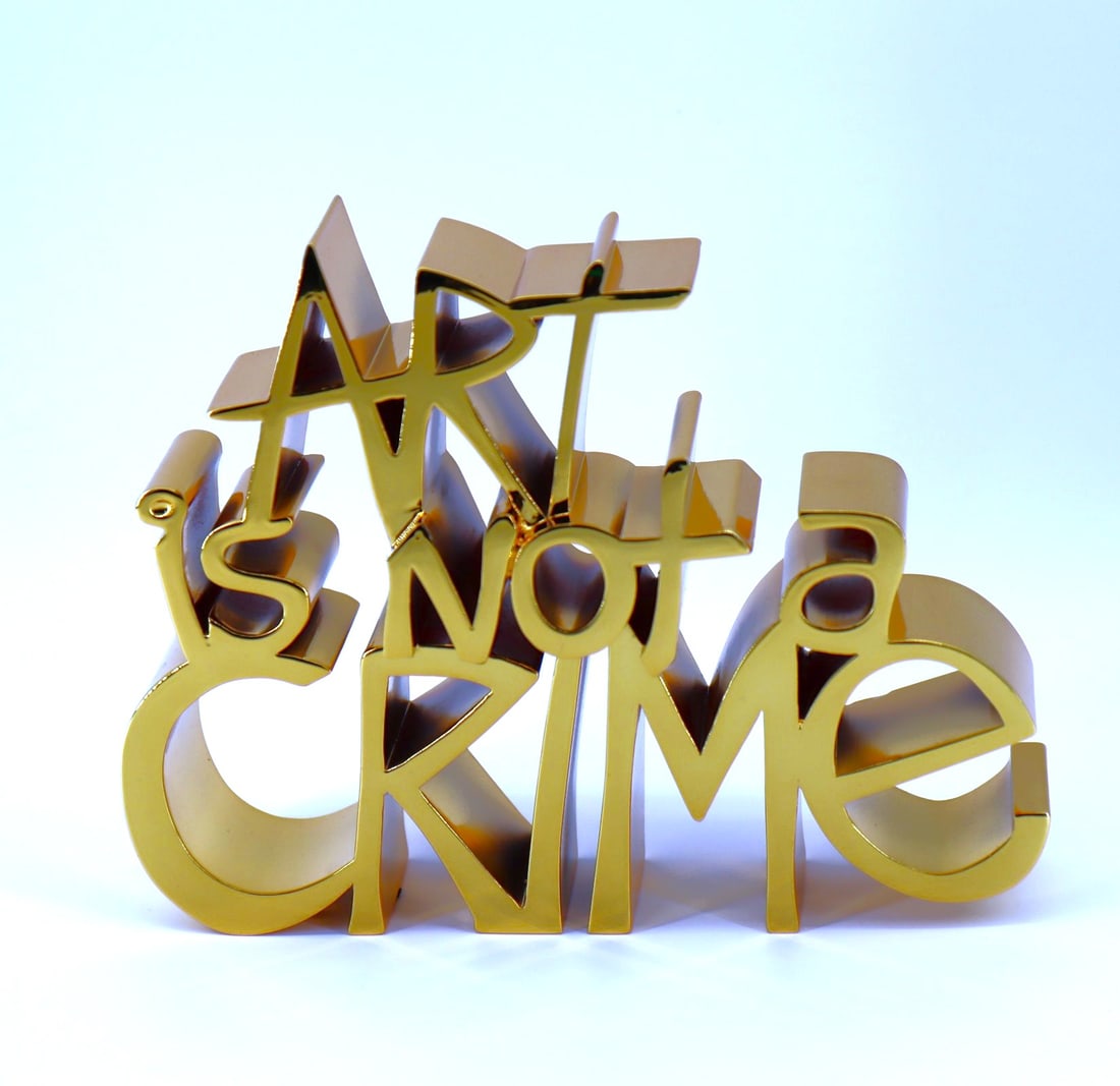 Mr. Brainwash, 'Art is Not A Crime', Gold 3D Sculpture, 2021 w/ COA: Artist: Mr. Brainwash Medium: Chrome Painted Resin Sculpture Title: Art is Not a Crime - Hard Candy Gold Year: 2021 Signed: Hand Signed Edition: 11/95 Image Size: 6.5 x 8.25 x 2 Comes With Original Mr
