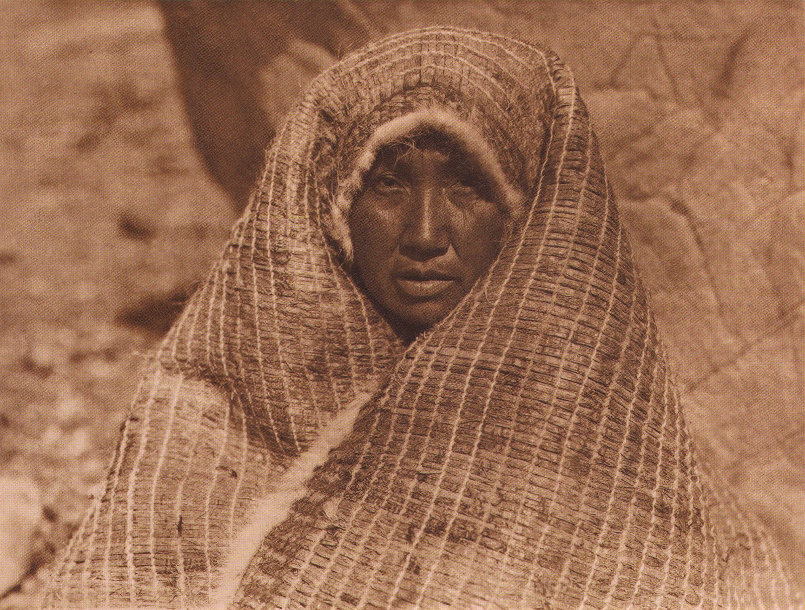 Edward S. Curtis, PLATE 48 Nootka Woman Wearing Cedar Bark Blanket, CA, 1915: Photographer: Edward S. Curtis (American, 1868 - 1952) - renowned photographer of the American West and the Native American Indian. Title: FIG. 45 Curtis Studio, (Edward S. Curtis and His Daughter Bet