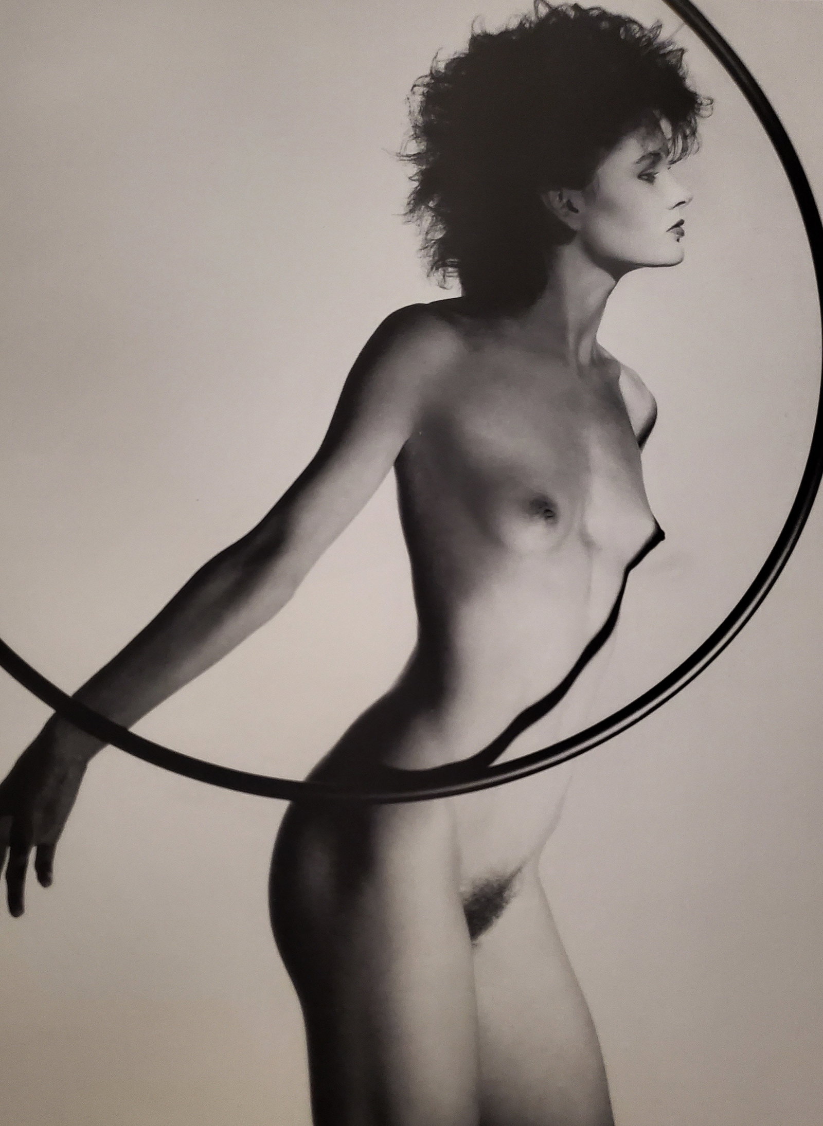 John Swannell, Hula Hoop Girl, 1980's: Photographer: John Swannell was born in 1946. After leaving school at 16, he worked first as an assistant at Vogue Studios and then assisted David Bailey for four years before setting up his own studi