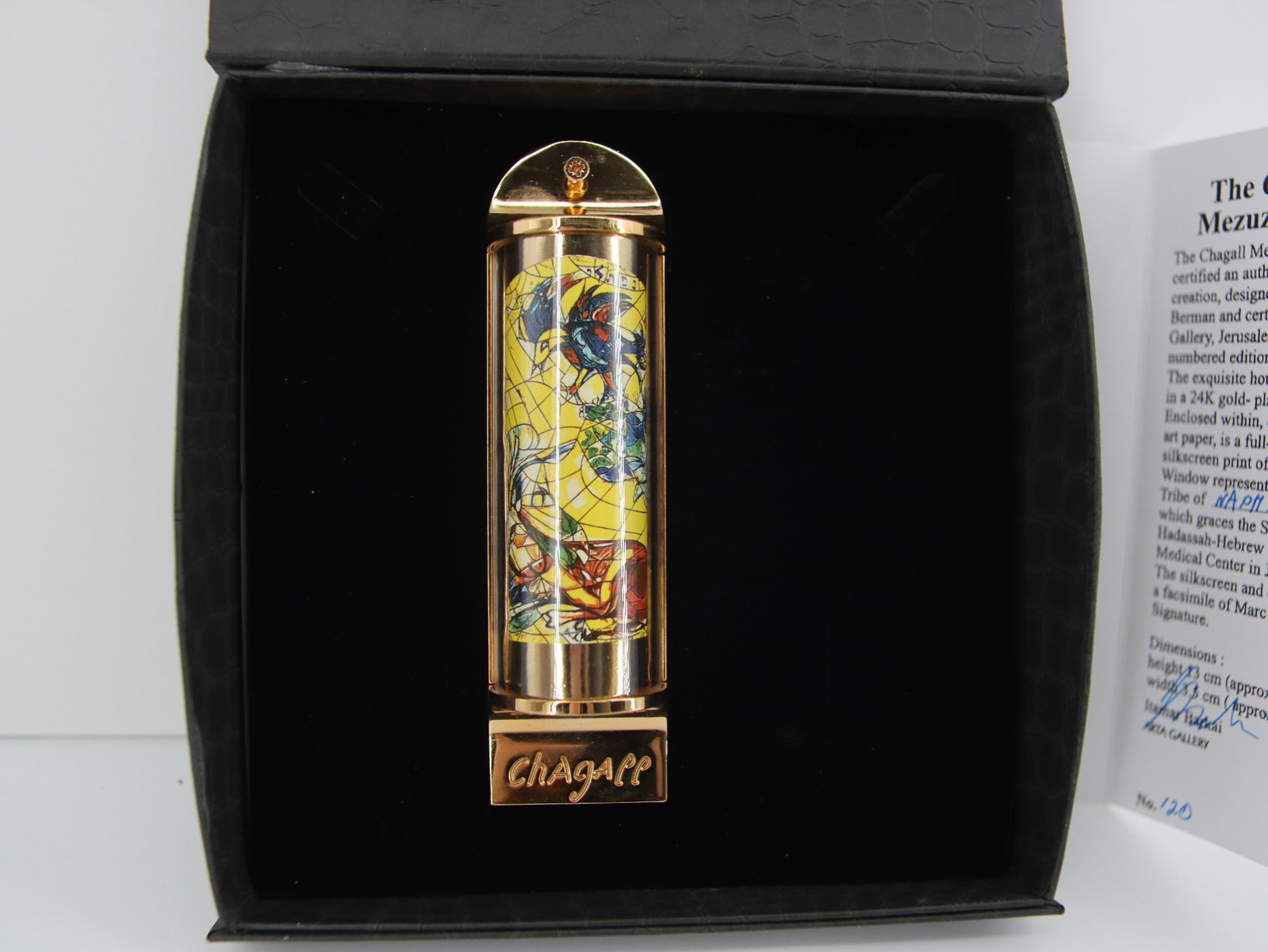 Marc Chagall, 'Naphtali', 24K Gold Plated Limited Edition Mezuzah: Artist: Marc Chagall Medium: Mezuzah - Exquisite glass housing is set in a 24K gold plated bronze with full color silkscreen TITLE: "NAPHTALI" (THE TWELVE TRIBES SERIES) Size: 5" x 1.5" Weight: 7 oz. 