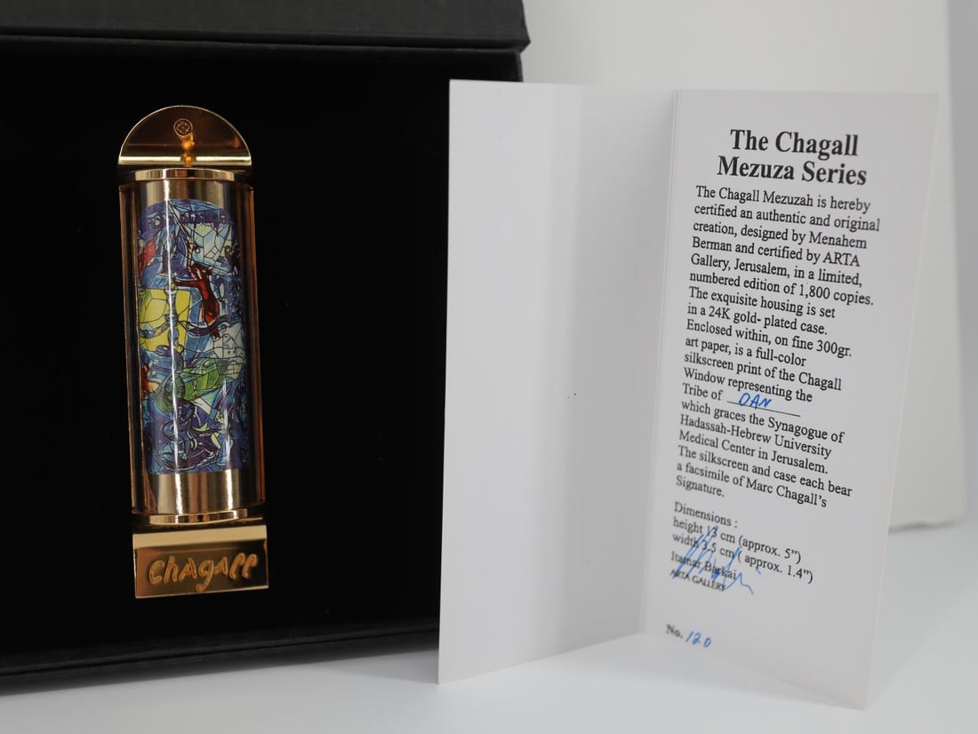 Marc Chagall, "Dan" Silk Screen in 24K Gold Plated Limited Edition Mezuzah: Artist: Marc Chagall Medium: Mezuzah - Exquisite glass housing is set in a 24K gold plated bronze with full color Silk Screen TITLE: DAN (THE TWELVE TRIBES SERIES) Size: 5" x 1.5" Weight: 7 oz. Limite