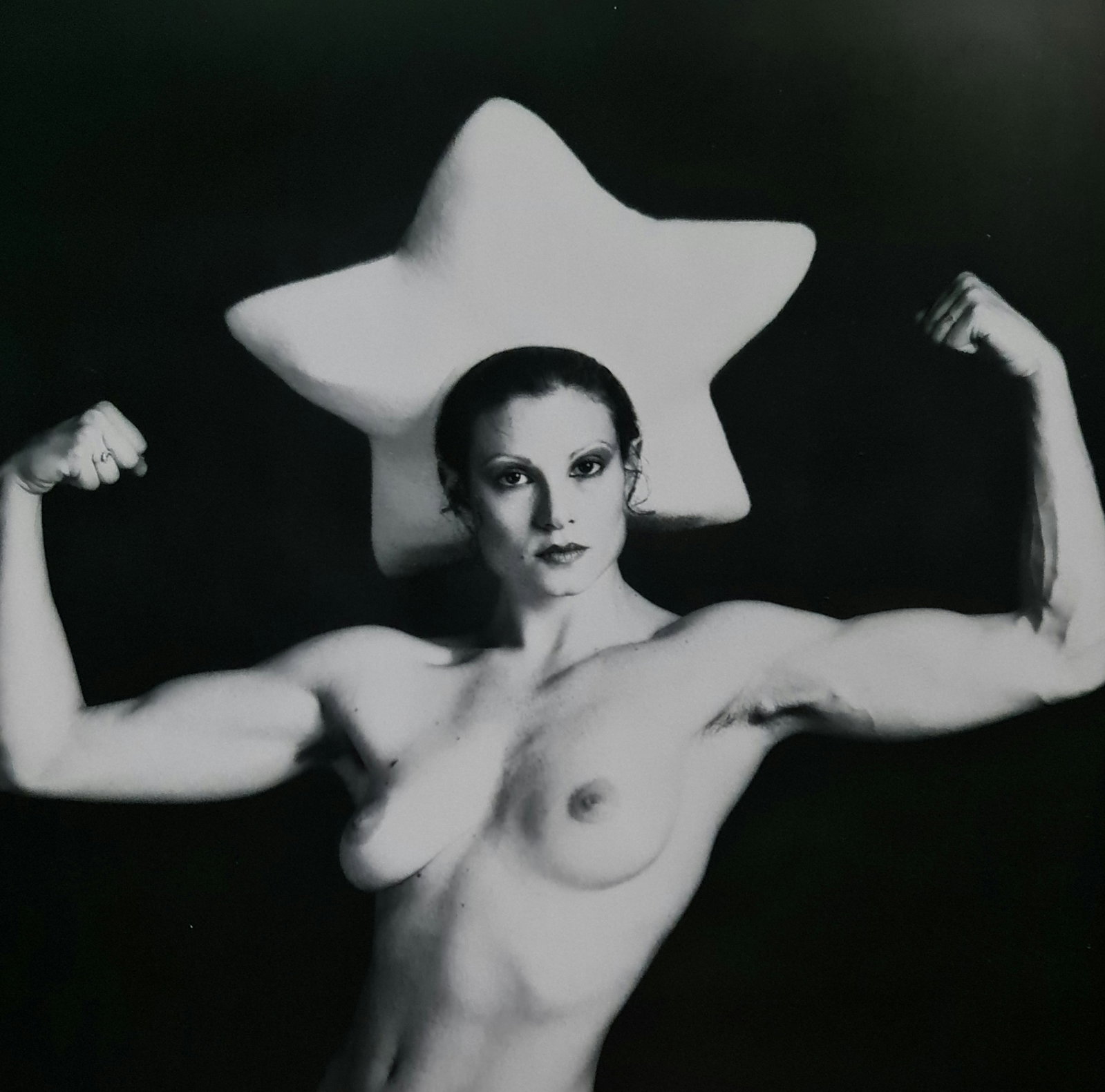 Robert Mapplethorpe, Lisa Lyon with star behind: Photographer: Robert Michael Mapplethorpe (1946-1989) was an American photographer, best known for his black-and-white photographs. His work featured an array of subjects, including celebrity portrait
