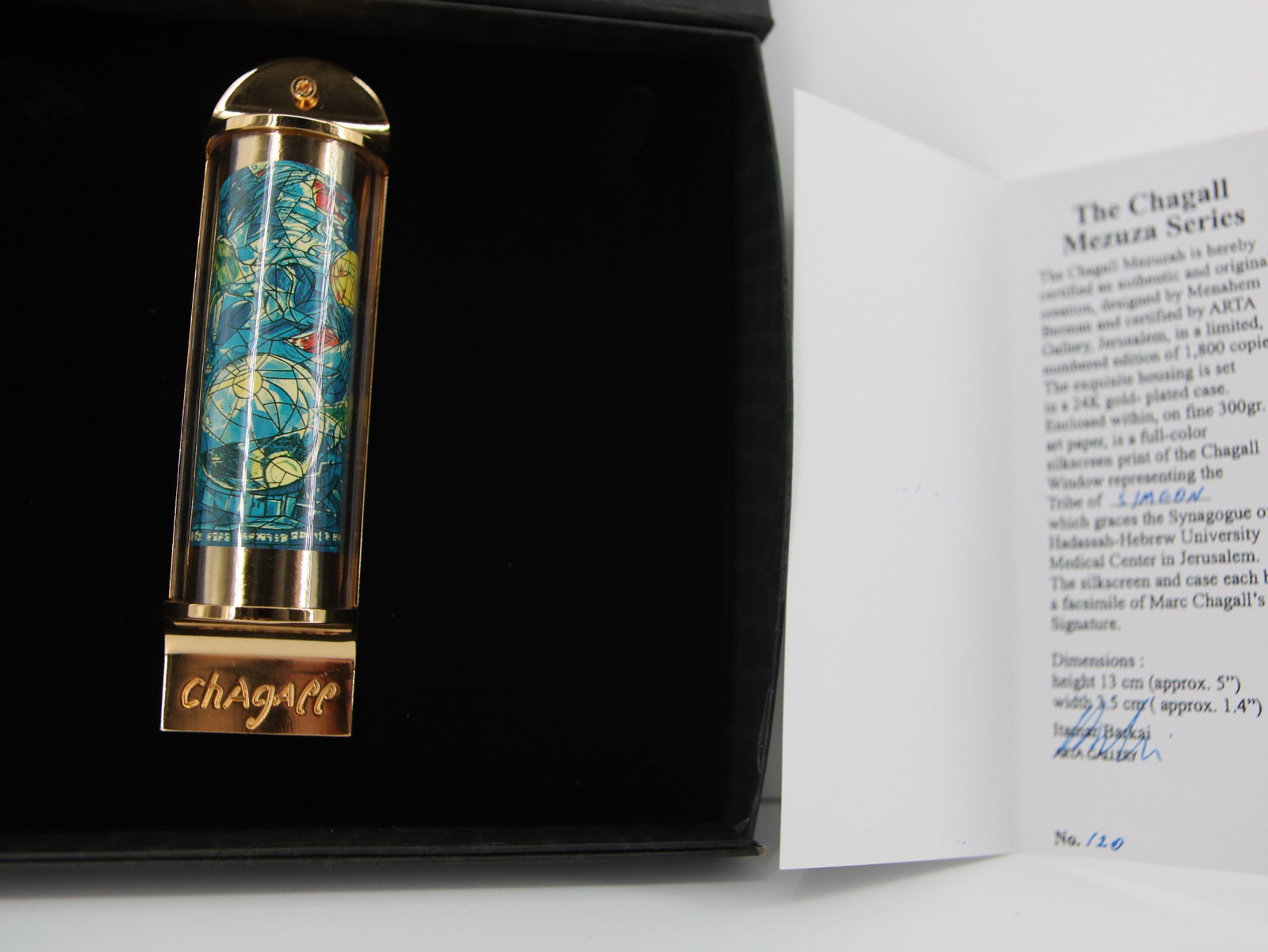 Marc Chagall, 'Simeon', 24K Gold Plated Limited Edition Mezuzah: Artist: Marc Chagall Medium: Mezuzah - Exquisite glass housing is set in a 24K gold plated bronze with full color silkscreen TITLE: "Simeon" (THE TWELVE TRIBES SERIES) Size: 5" x 1.5" Weight: 7 oz. Li
