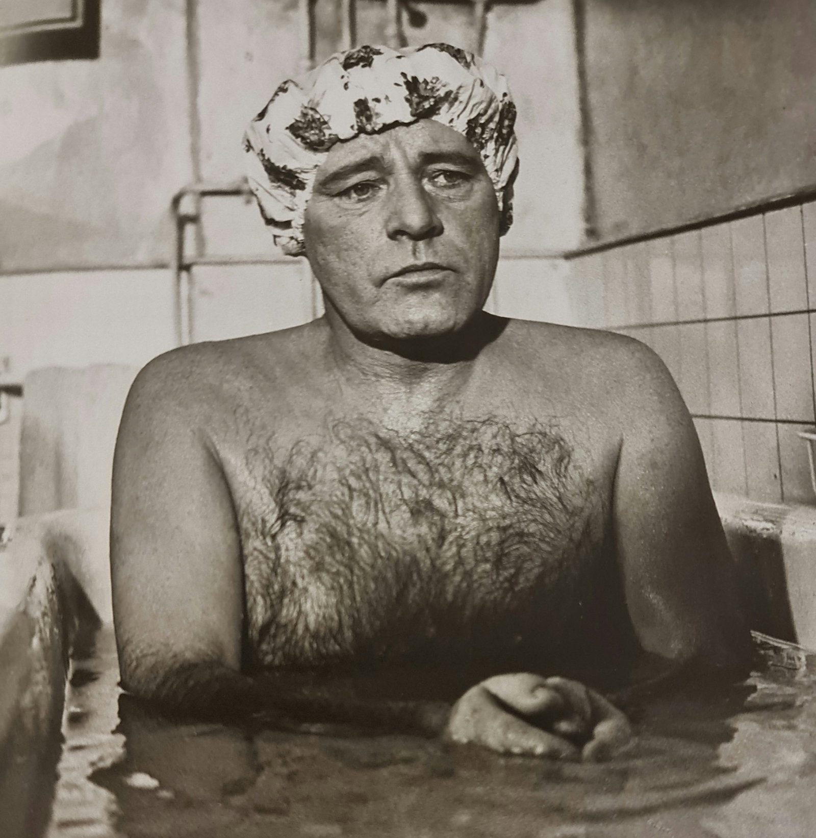 Terry O'Neill, Richard Burton Playing A Hairdresser In The Film Staircase, Paris, 1969: Photographer: Terry ONeill was a British photographer, known for documenting the fashions, styles, and celebrities of the 1960s. Title: Richard Burton playing a hairdresser in the film Staircase, Pari