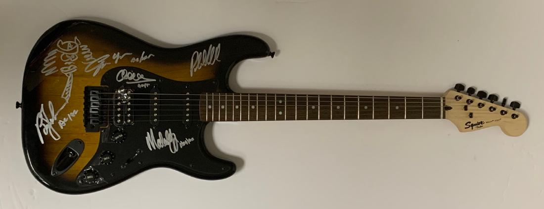 AC/DC Autographed Guitar: Killer AC/DC guitar signed by Angus with his infamous sketch Malcolm Brian Cliff and Phil.