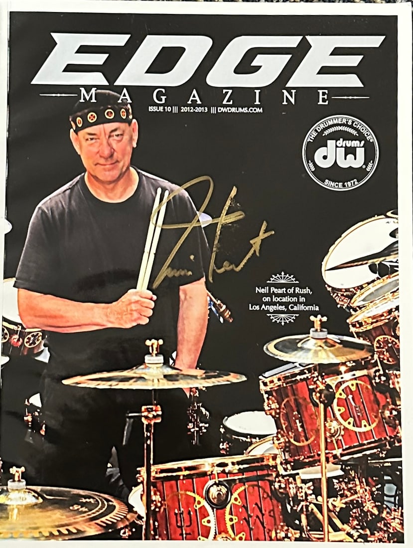 Neil Peart Autographed Magazine: Displays are not framed, and can be framed for a cost. Framed items will state they are framed in the name of the item. All signed items come with a COA. All items now come with a 3rd Party COA from P