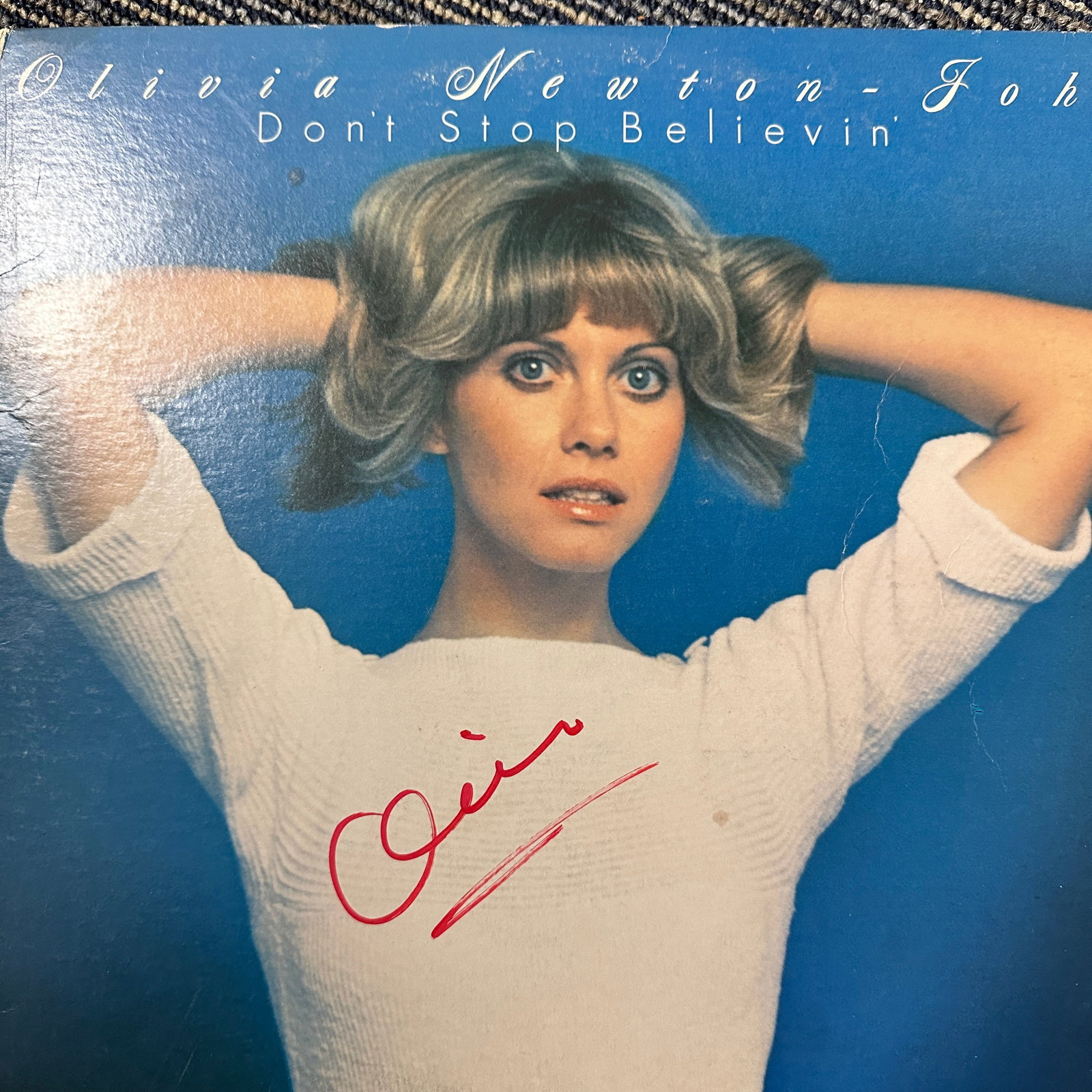 Olivia Autographed Album: Displays are not framed, and can be framed for a cost. Framed items will state they are framed in the name of the item. All signed items come with a COA. All items now come with a 3rd Party COA from P