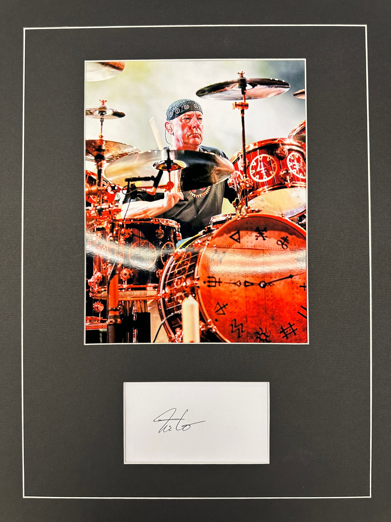 Neil Peart Autograph Display: Displays are not framed, and can be framed for a cost. Framed items will state they are framed in the name of the item. All signed items come with a COA. All items now come with a 3rd Party COA from P