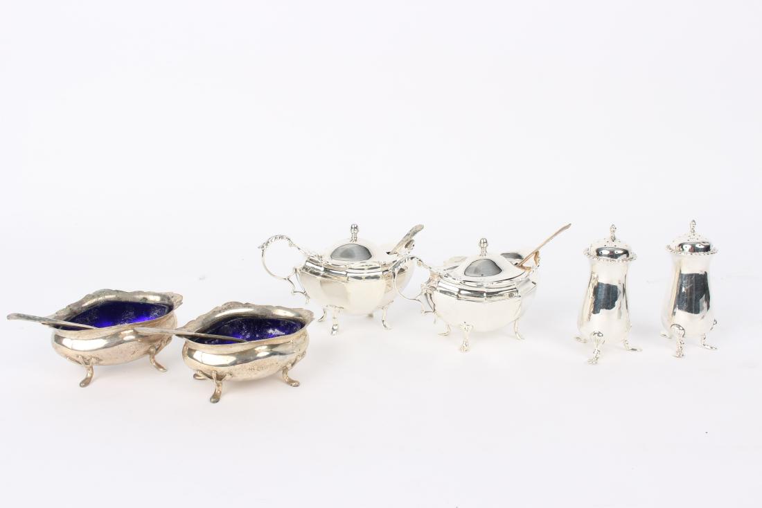 A matched silver cruet set, various dates, comprising a (1 of 3)