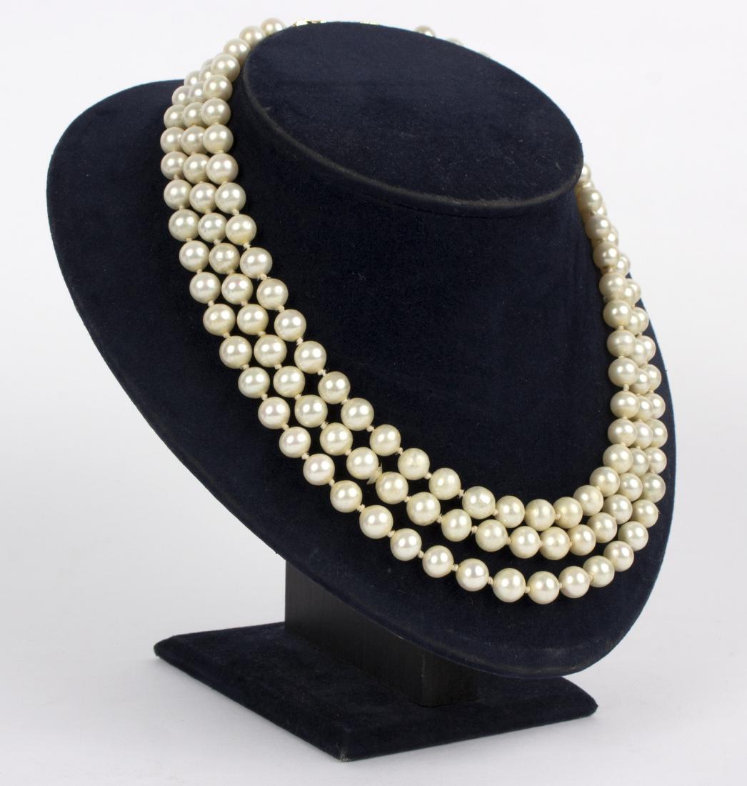 A three-row faux pearl necklace and bracelet, each with: A three-row faux pearl necklace and bracelet, each with textured 18ct gold rectangular clasp, HJ Co., circa 1965, possibly Andrew Grima/Provenance: Beverston Castle