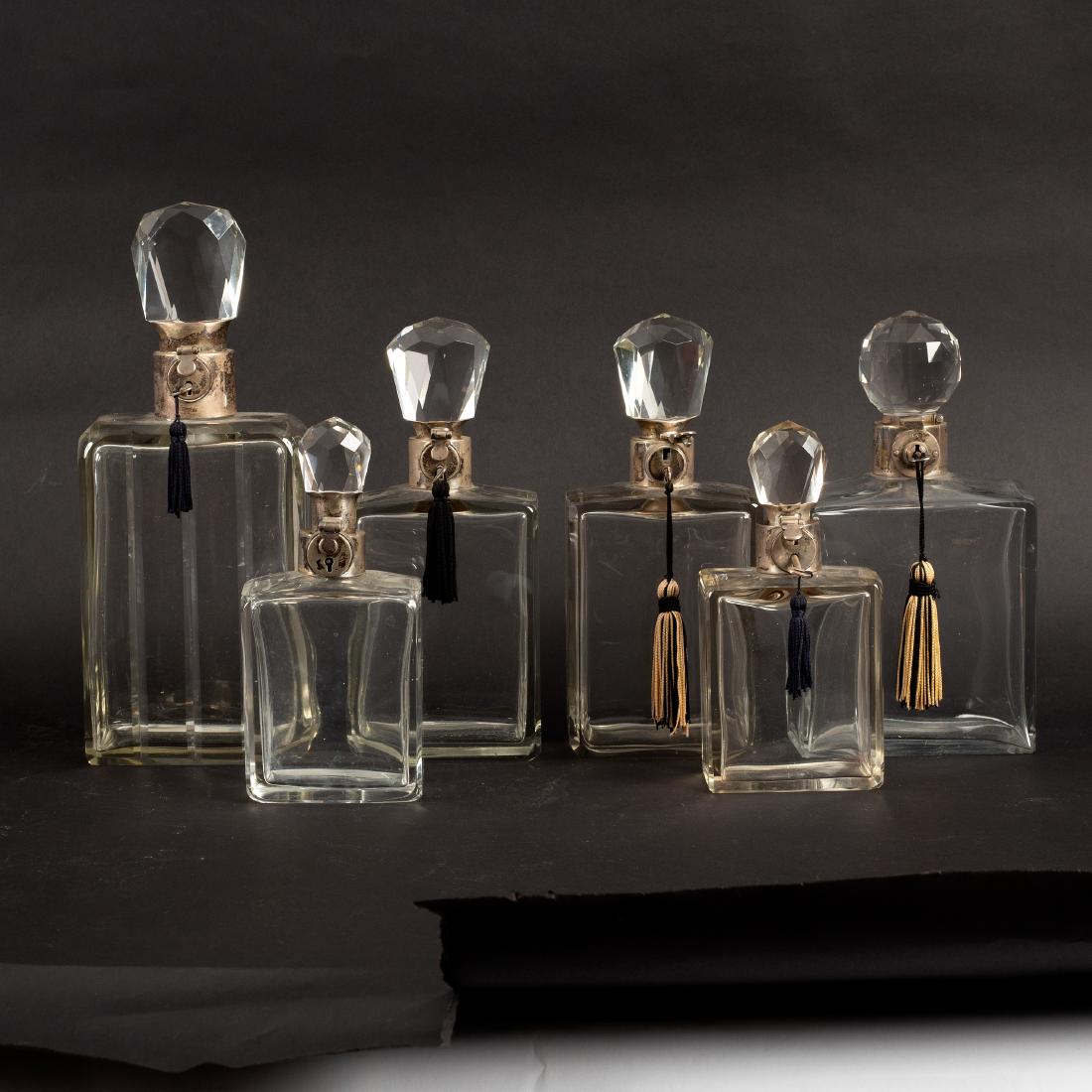 Six graduated glass decanters, all with silver mounted (1 of 2)