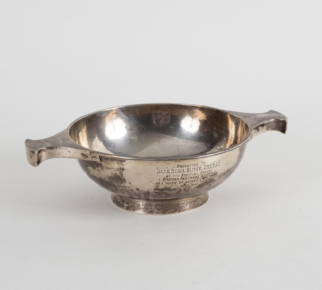 A large silver quaich, AE Jones, Birmingham 1937, with: A large silver quaich, AE Jones, Birmingham 1937, with inscription to Dame Beryl Oliver....1947, 25.5cm wide, approximately 350gm