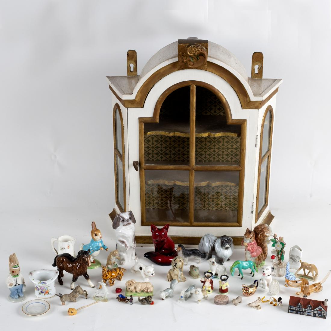 A Royal Copenhagen figure of a Pekingese dog on its (1 of 2)