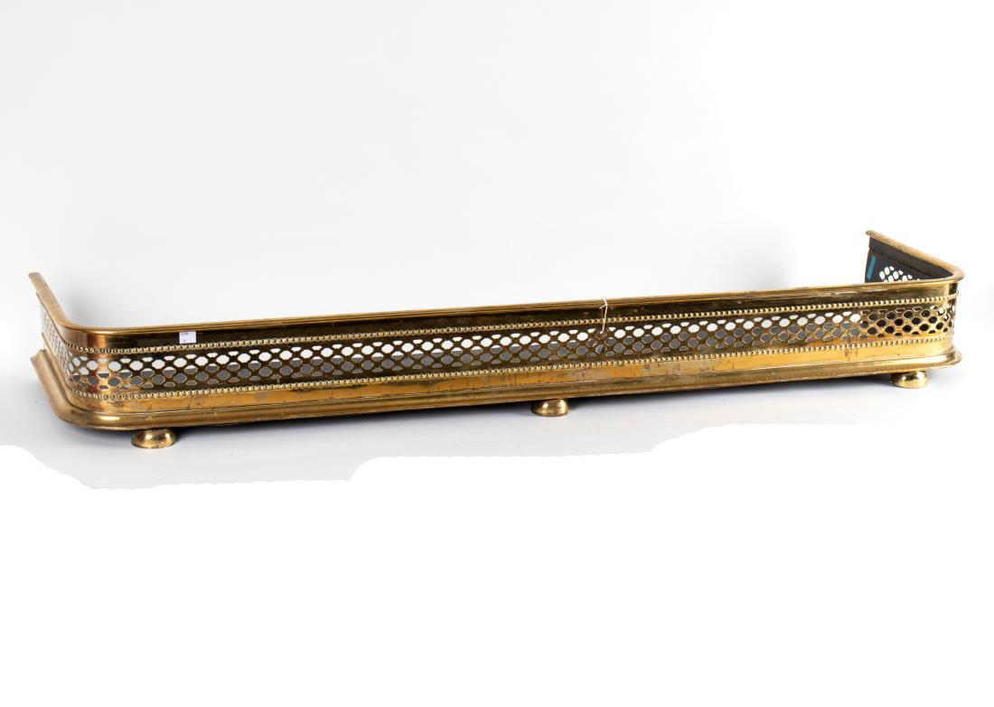 A 19th Century pierced brass D-shaped fender, 147.5cm: A 19th Century pierced brass D-shaped fender, 147.5cm wide
